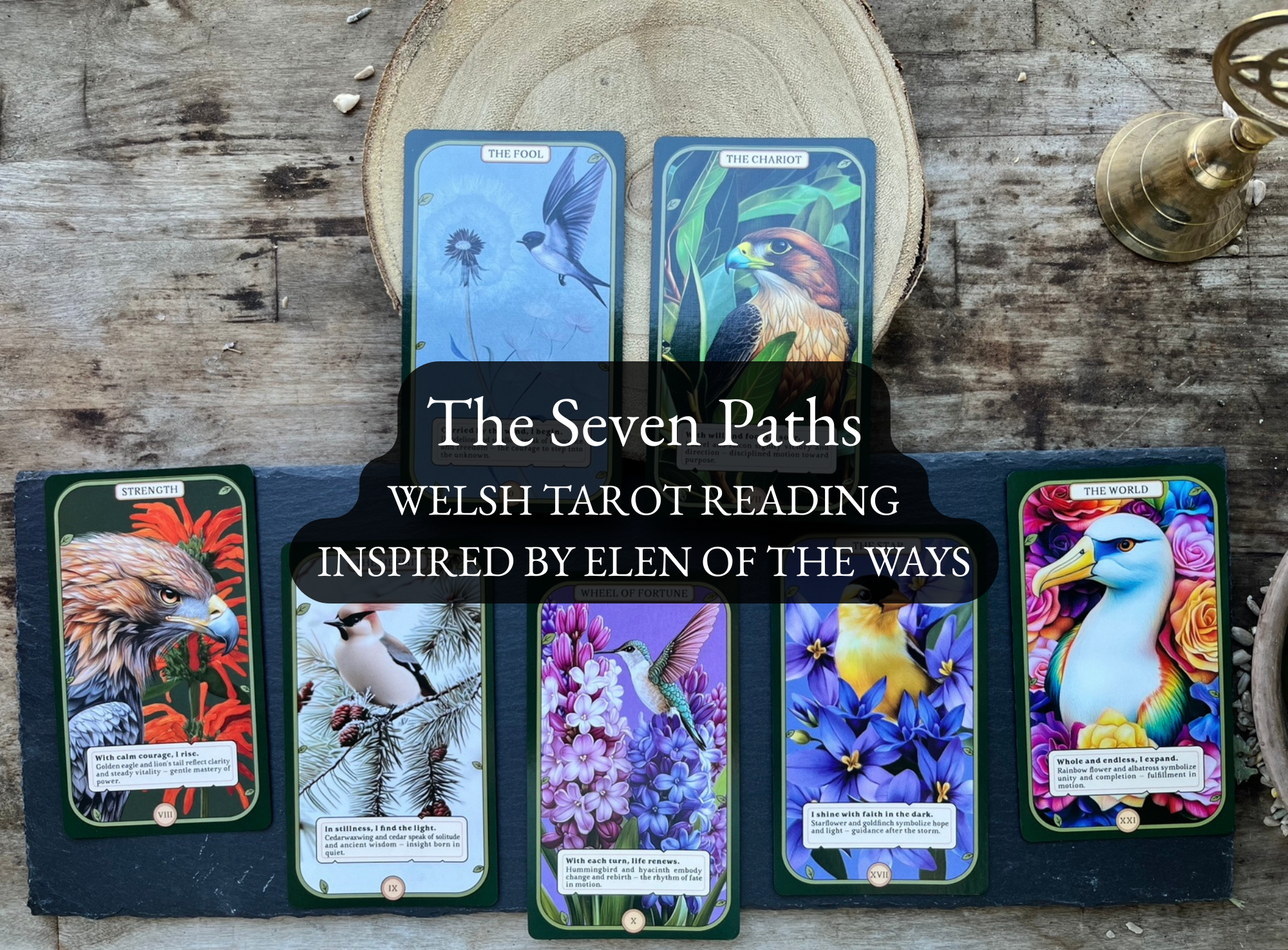 Five Welsh tarot cards from 'The Seven Paths' deck are arranged on a dark slate board over a rustic wooden surface, with a wood slice and brass candle holder in the background. A black text overlay reads 'The Seven Paths WELSH TAROT READING INSPIRED BY ELEN OF THE WAYS'.